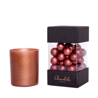 Salted caramel filling in dark chocolate and JOIK salted-caramel-scented candle
